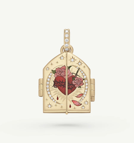 Gold locket featuring an engraved heart design with rose motifs and diamond accents.