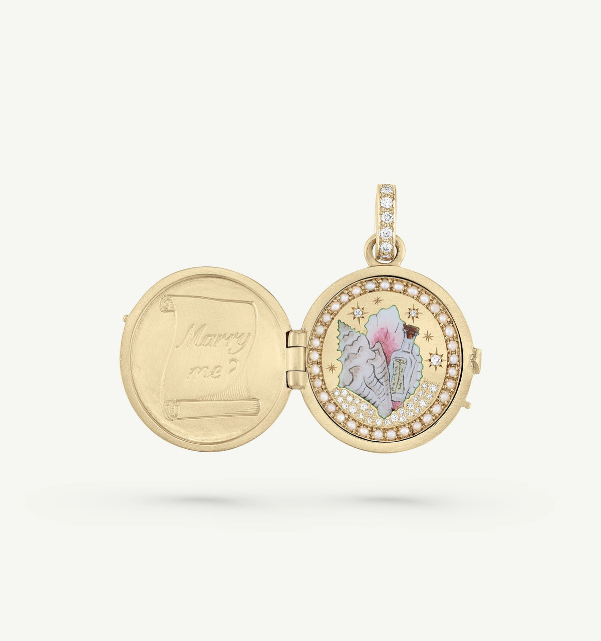Gold locket featuring a colourful interior design and a message "Marry me?" with a diamond-encrusted border.