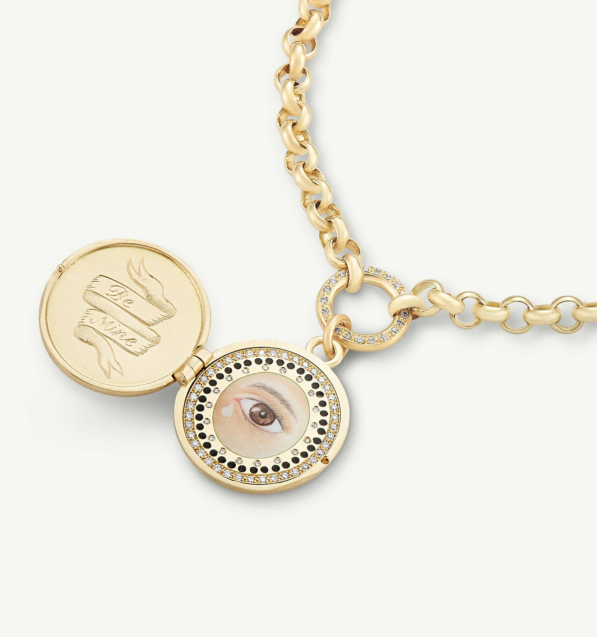Gold locket necklace featuring an engraved design and an eye illustration surrounded by diamonds.