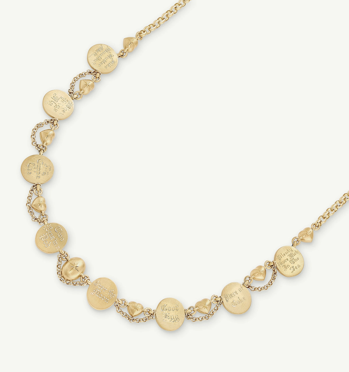 Gold necklace featuring engraved circular pendants and heart motifs connected by a delicate chain.