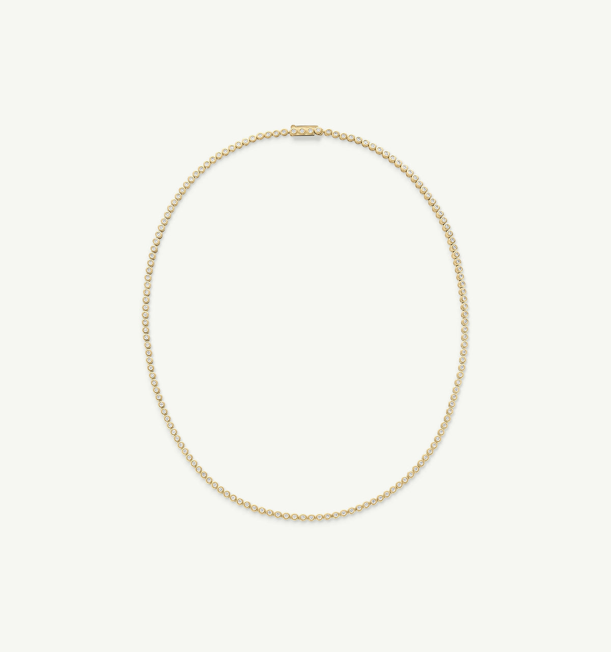 Gold chain necklace featuring delicate circular links in a continuous design.