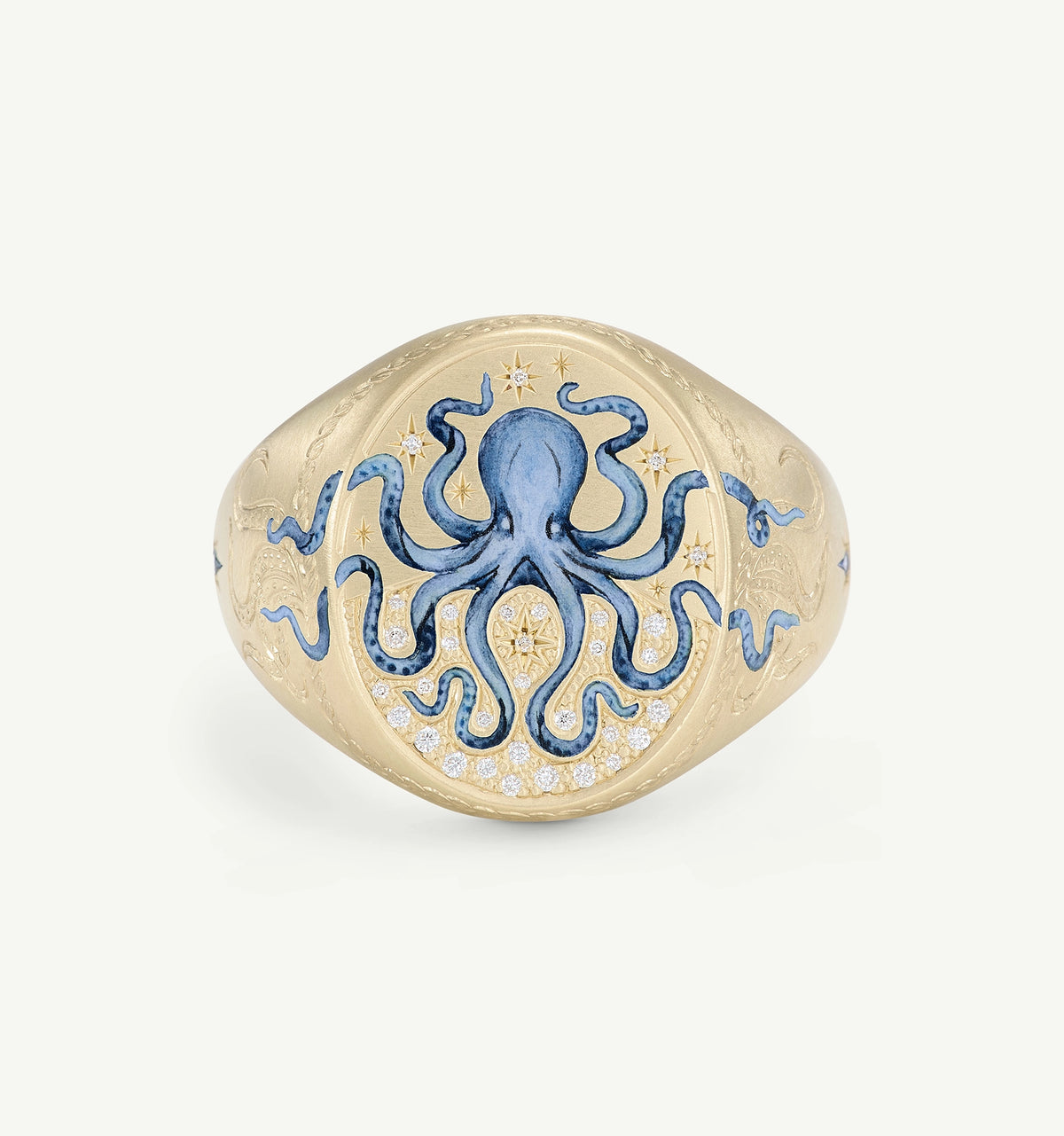 Gold ring featuring an octopus design in blue enamel and engraved details.