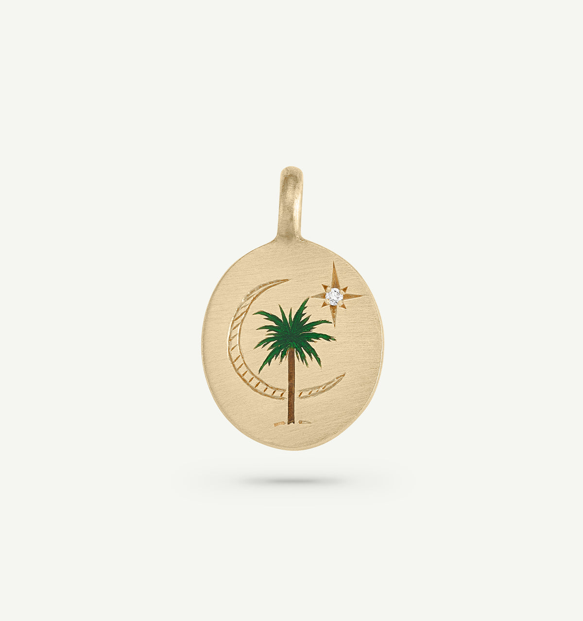 Gold pendant featuring an engraved palm tree and crescent moon with a diamond accent and green enamel detailing.