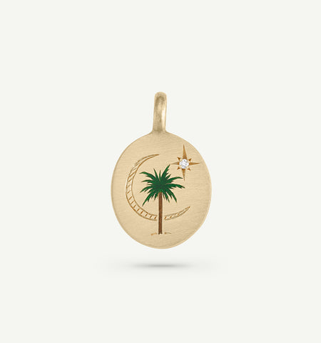 Gold pendant featuring an engraved palm tree and crescent moon with a diamond accent and green enamel detailing.