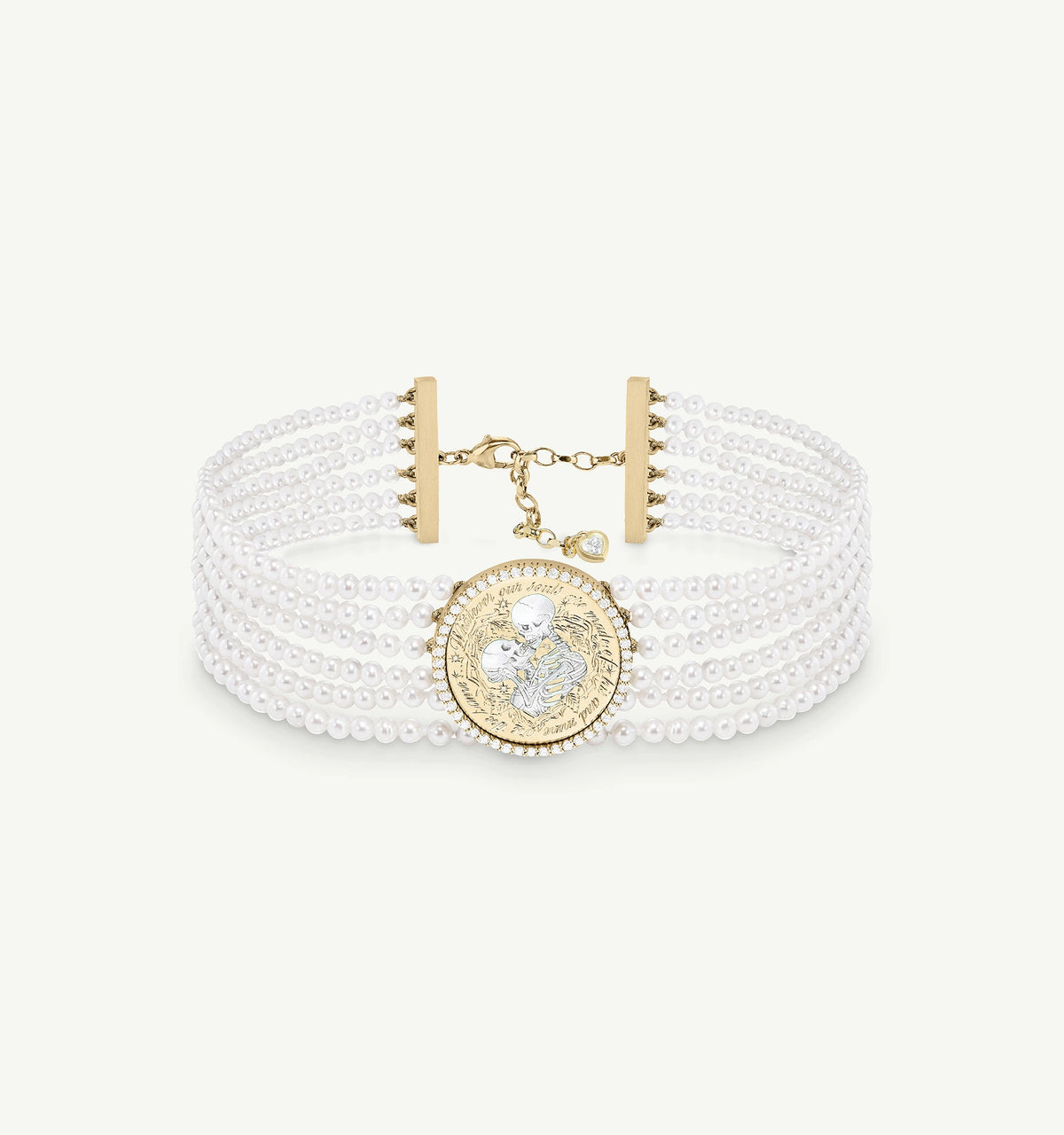 Gold bracelet featuring a circular charm with an engraved design, surrounded by strands of pearls.