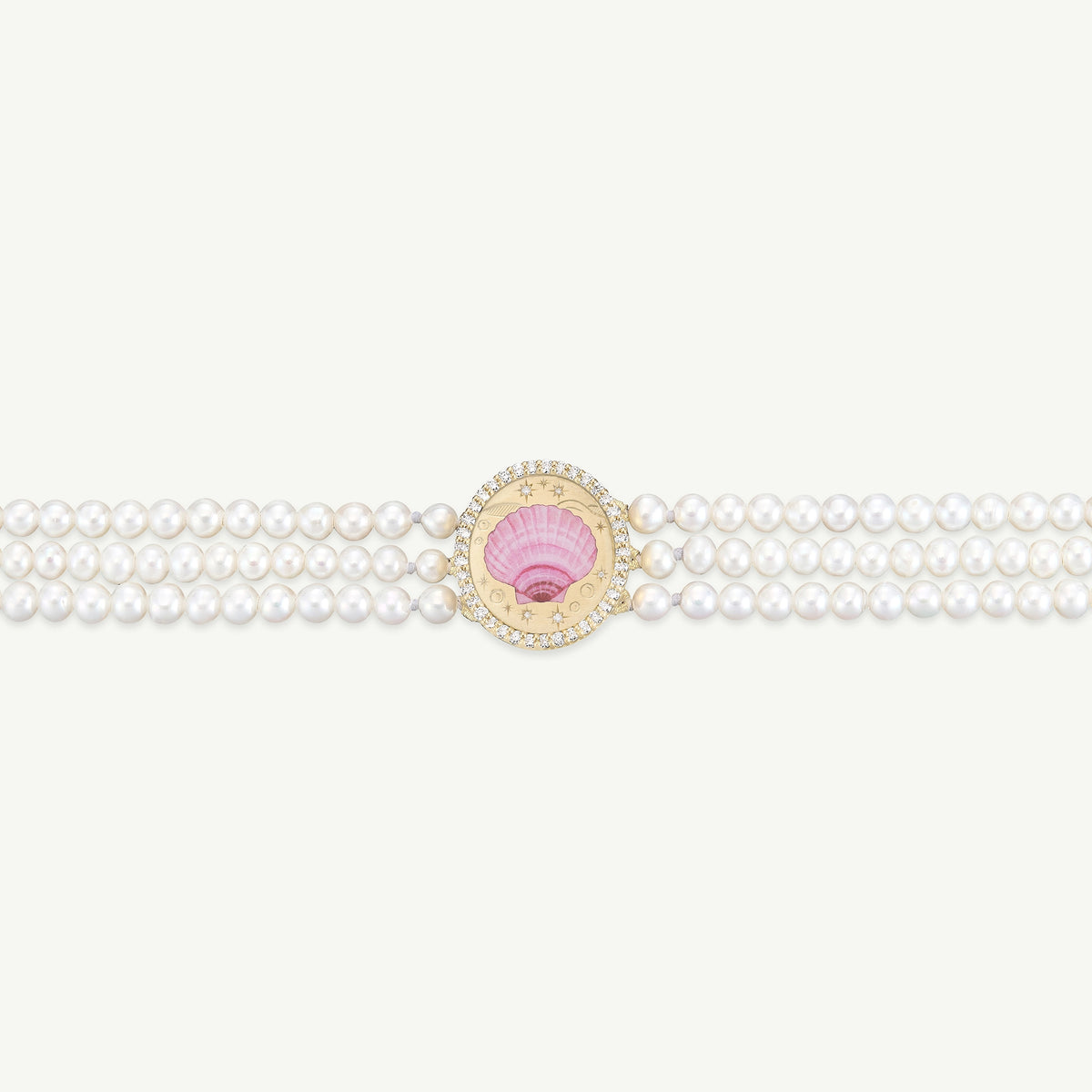 Gold bracelet featuring a pink shell motif surrounded by pearls and adorned with diamonds.