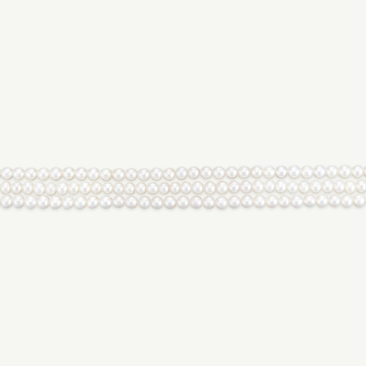 Gold necklace featuring a strand of white pearls arranged in multiple layers.