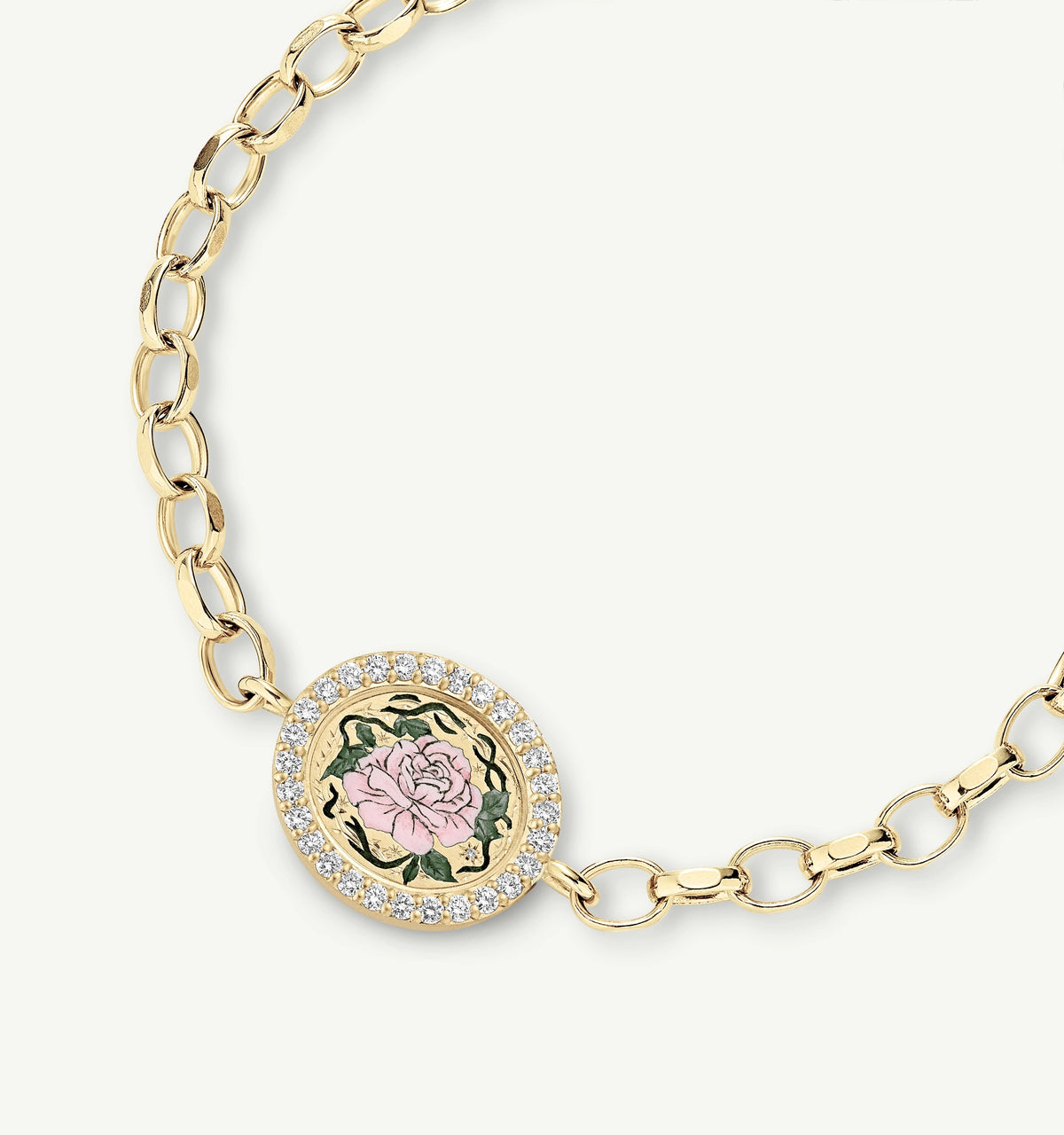 Gold bracelet featuring an oval pendant with a pink rose in enamel surrounded by a halo of white diamonds.