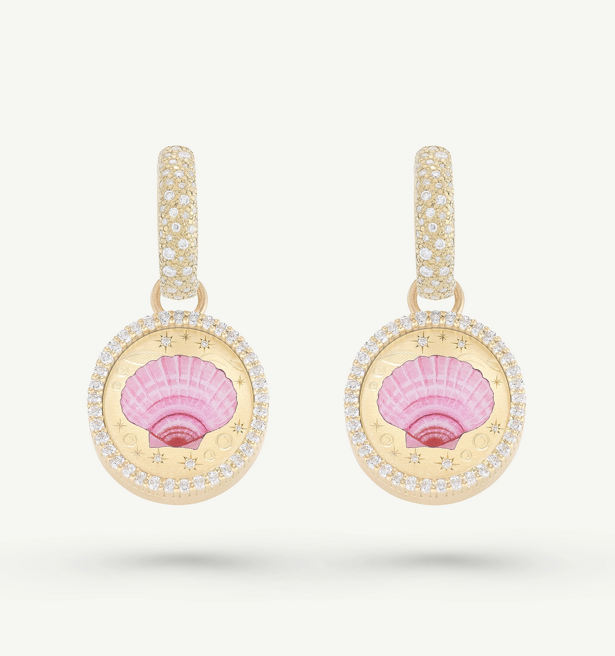 Gold earrings featuring pink enamel shell design surrounded by a halo of diamonds.