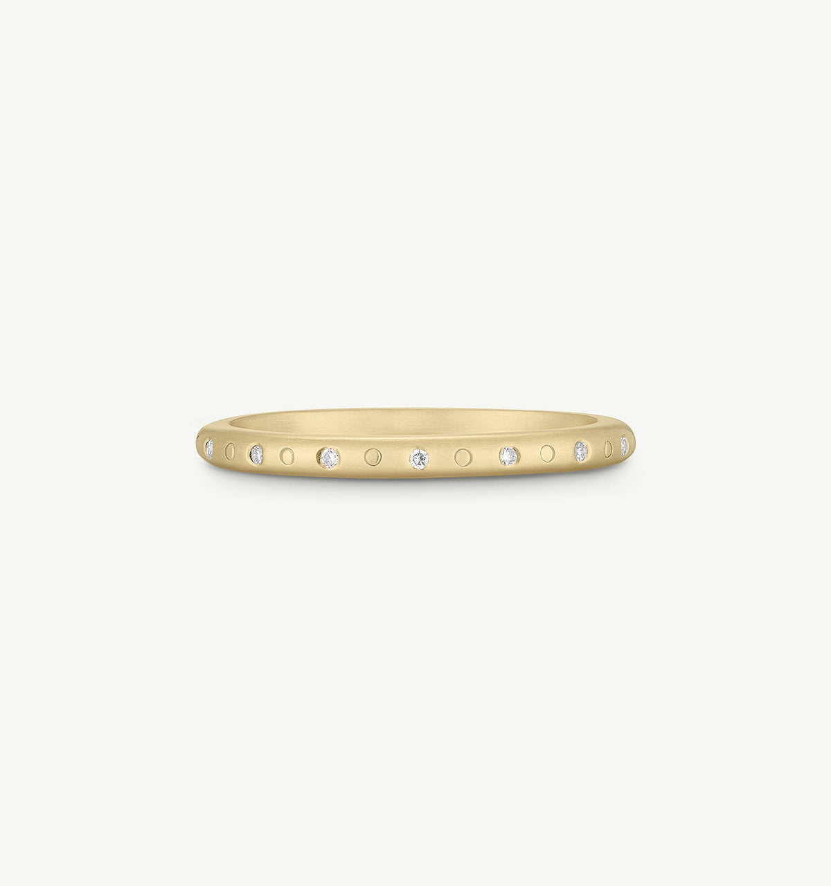 Gold ring featuring small diamonds set in a textured band design.