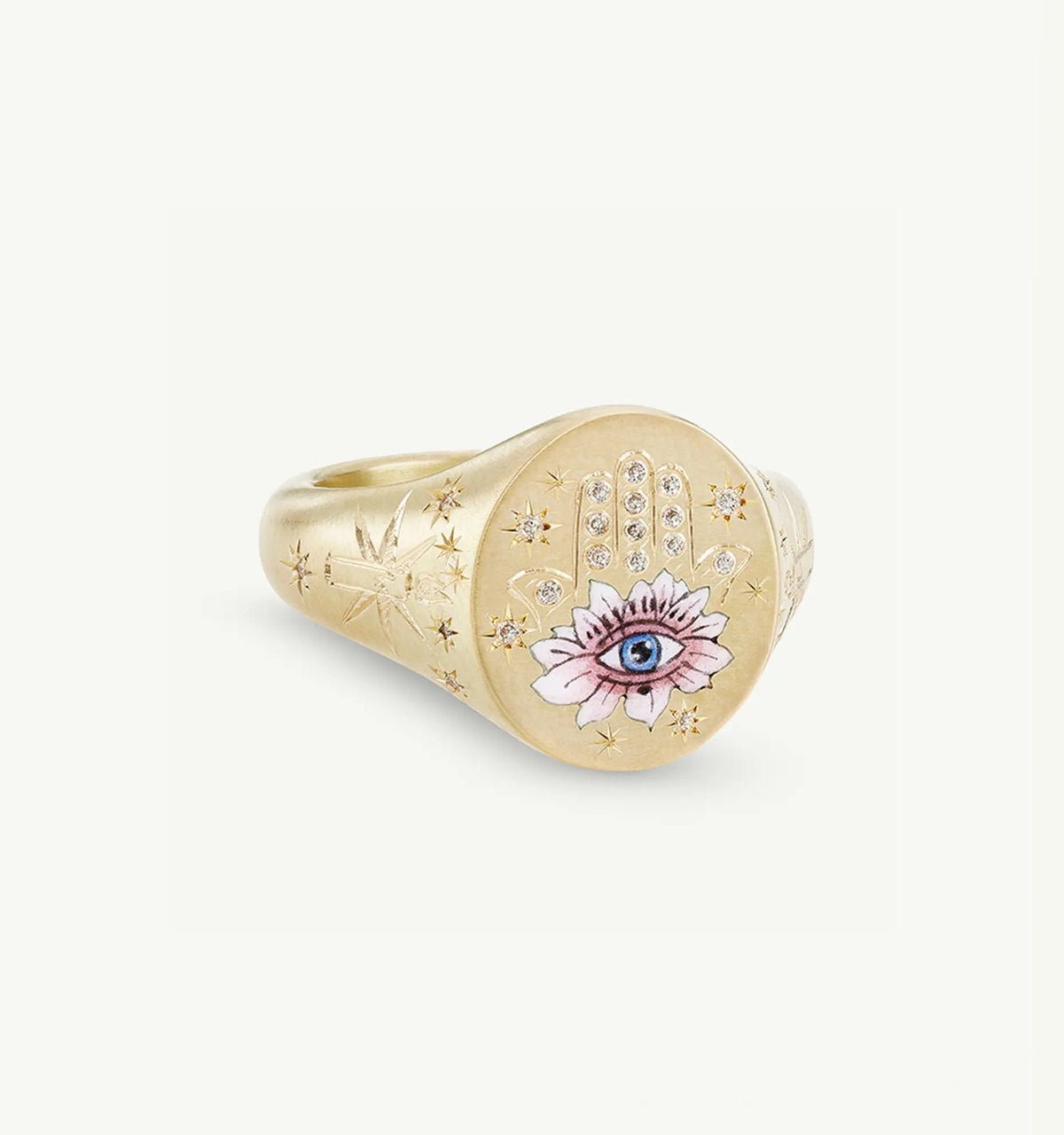 Gold ring featuring an engraved hand motif and a floral design with an eye, set with small diamonds.
