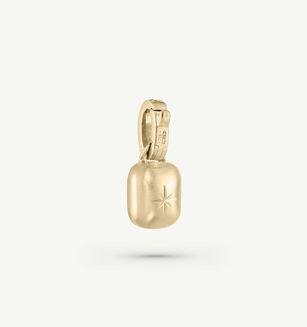 Gold pendant featuring a star engraving on a rounded rectangular base.