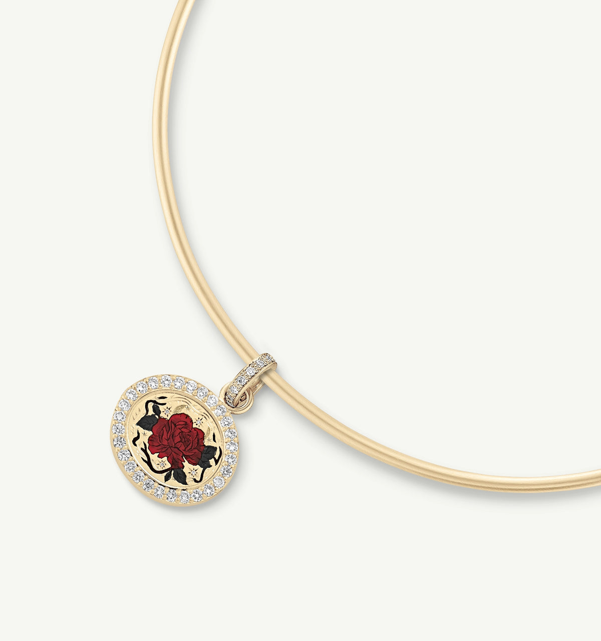 Gold pendant with an enamel rose design, surrounded by a ring of diamonds, suspended from a gold necklace.