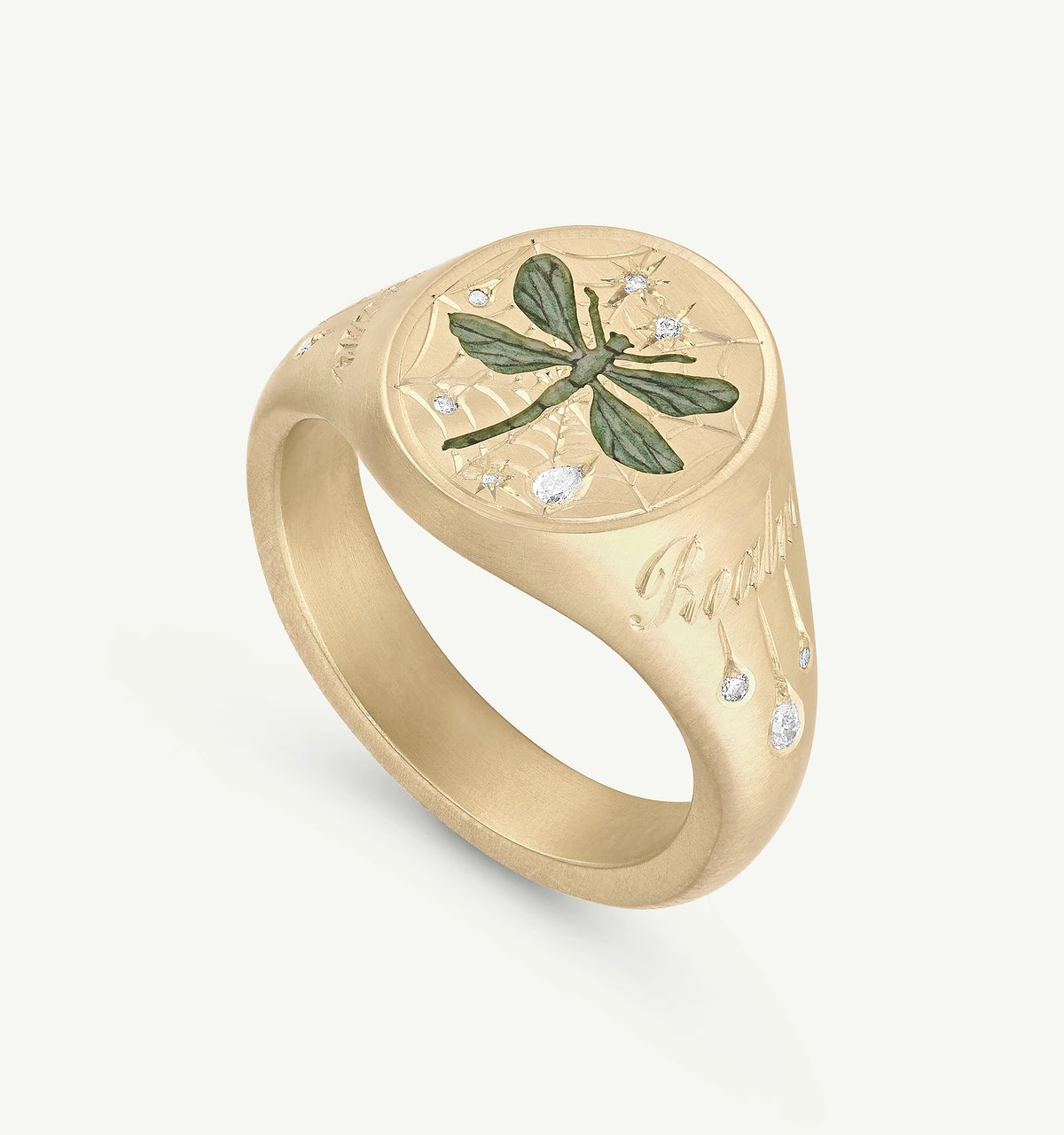 Gold ring featuring a dragonfly design and multiple diamonds set in a web pattern.