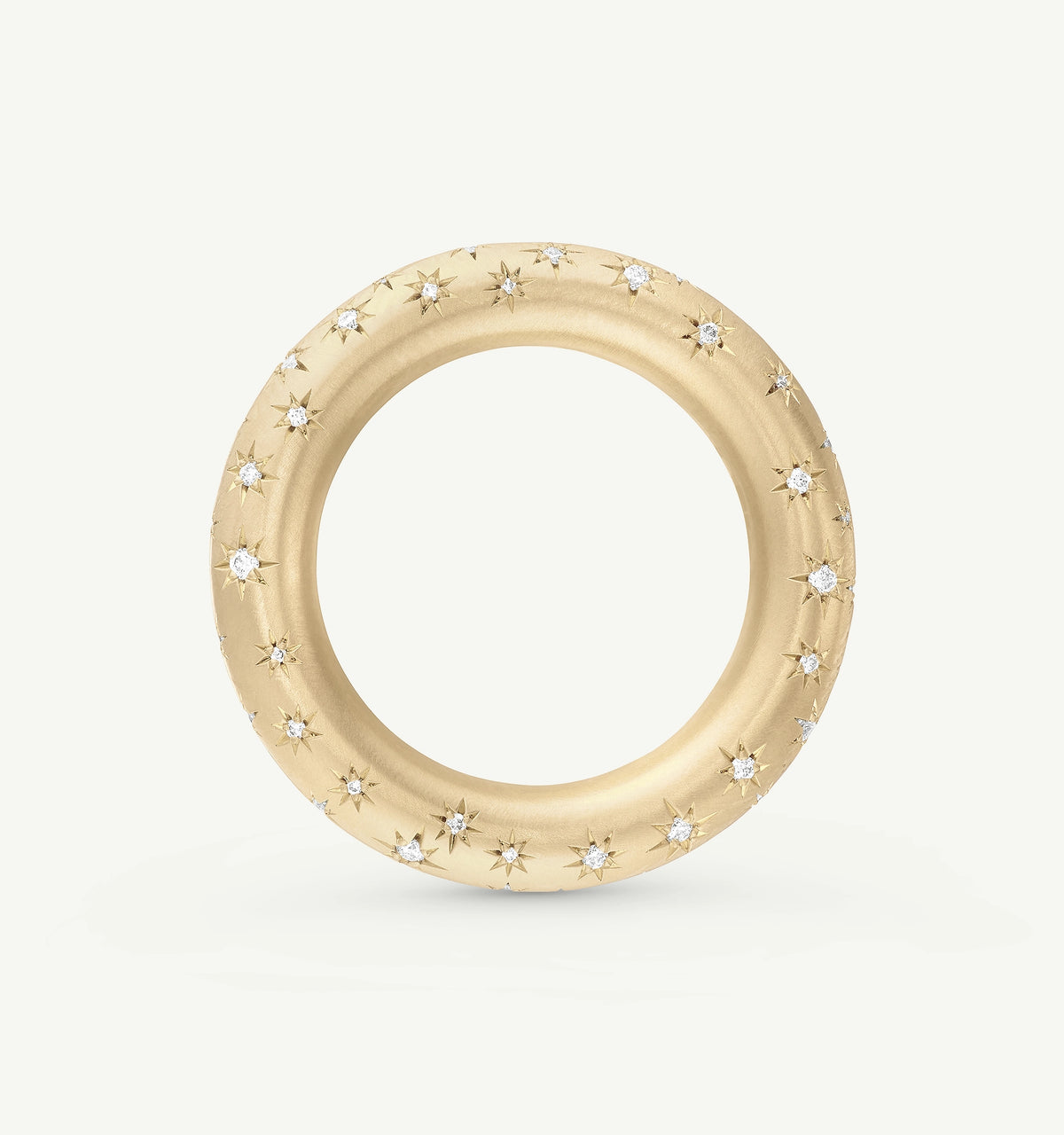 Gold ring featuring star motifs and diamond accents.