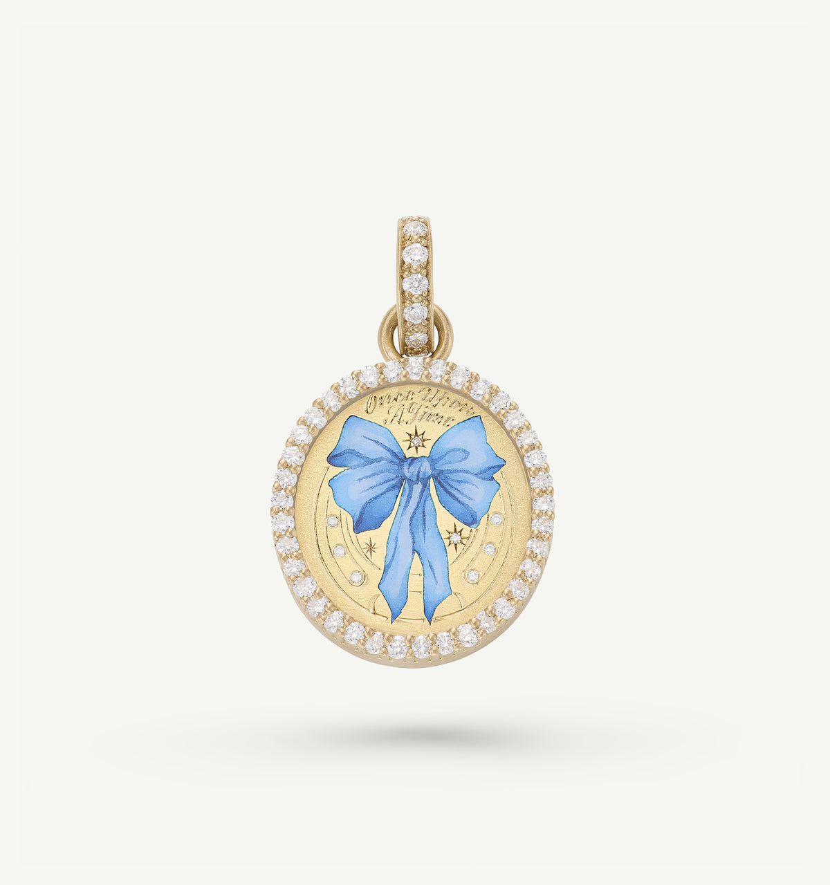 Gold pendant featuring a blue ribbon in enamel surrounded by a halo of diamonds.
