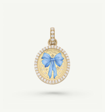 Gold pendant featuring a blue ribbon in enamel surrounded by a halo of diamonds.