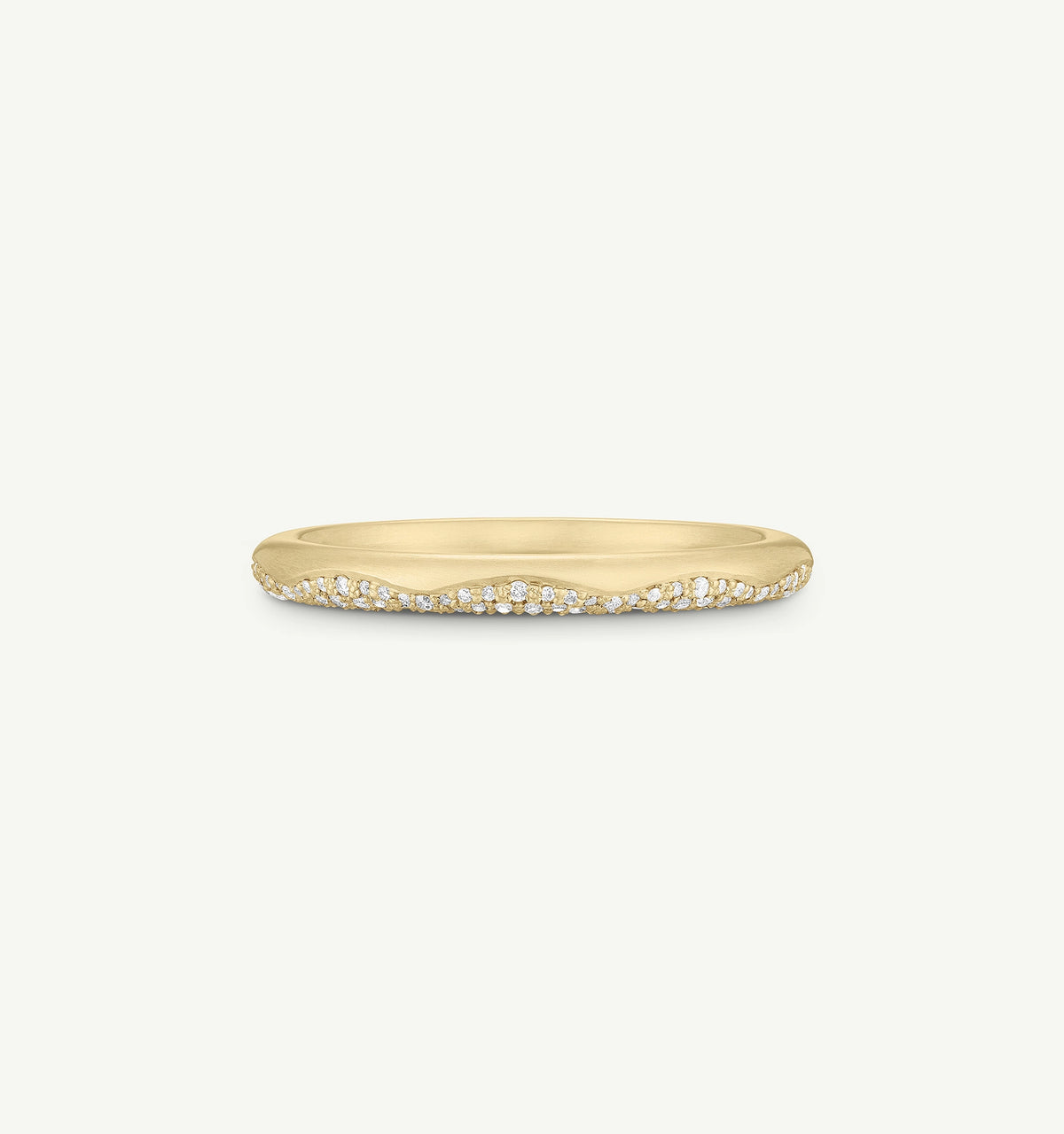 Gold band ring featuring a wavy edge with white diamonds set into the design.