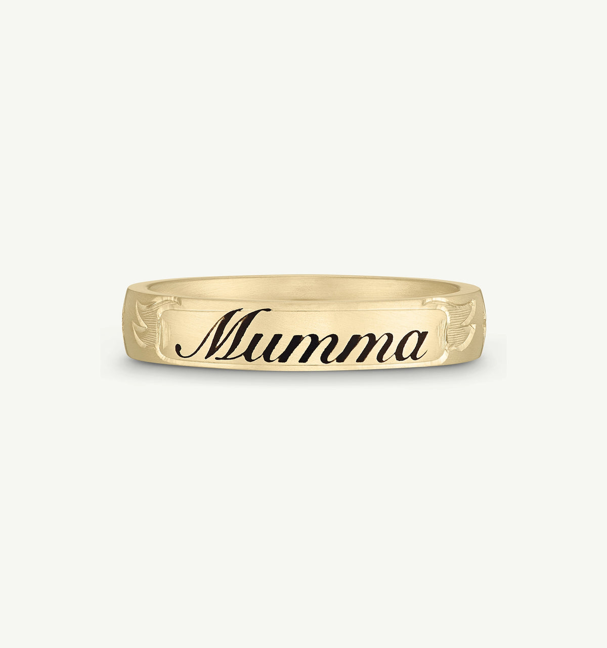 Gold ring featuring the engraved name "Mumma" and decorative detailing on the band.