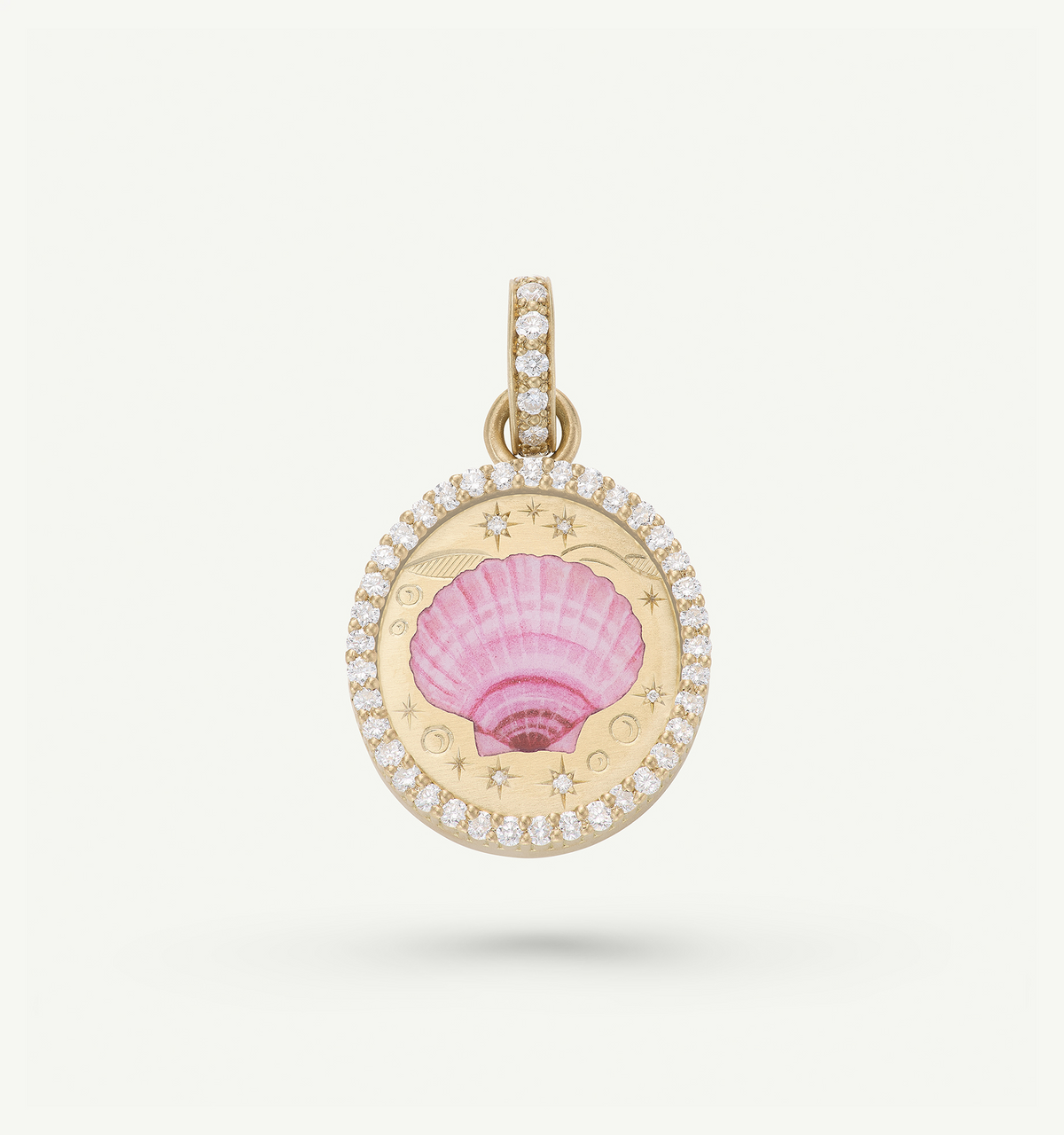 Gold pendant featuring a pink shell motif, encircled by a halo of diamonds.