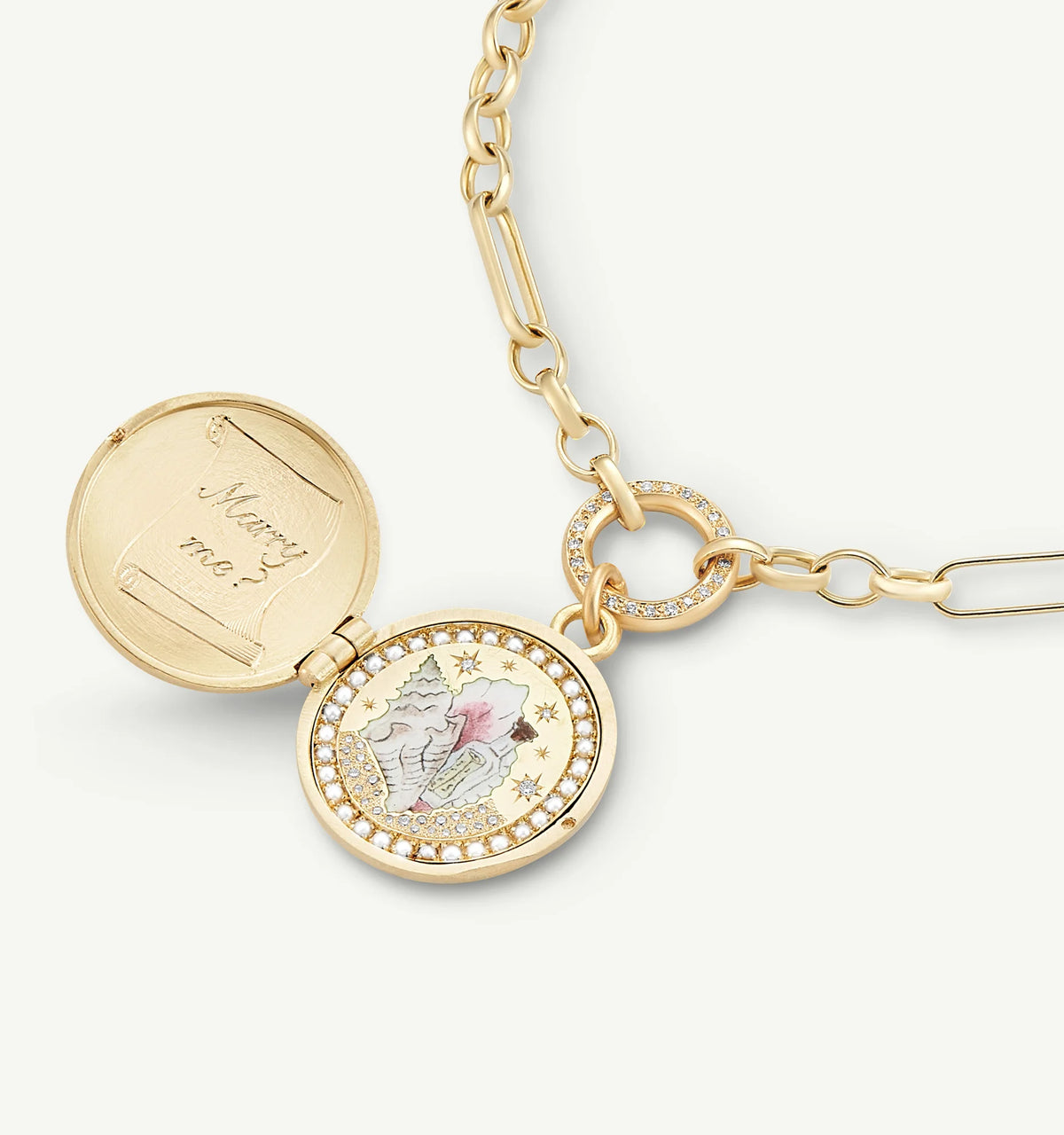 Gold locket necklace with an engraved message inside and decorative border of small diamonds.