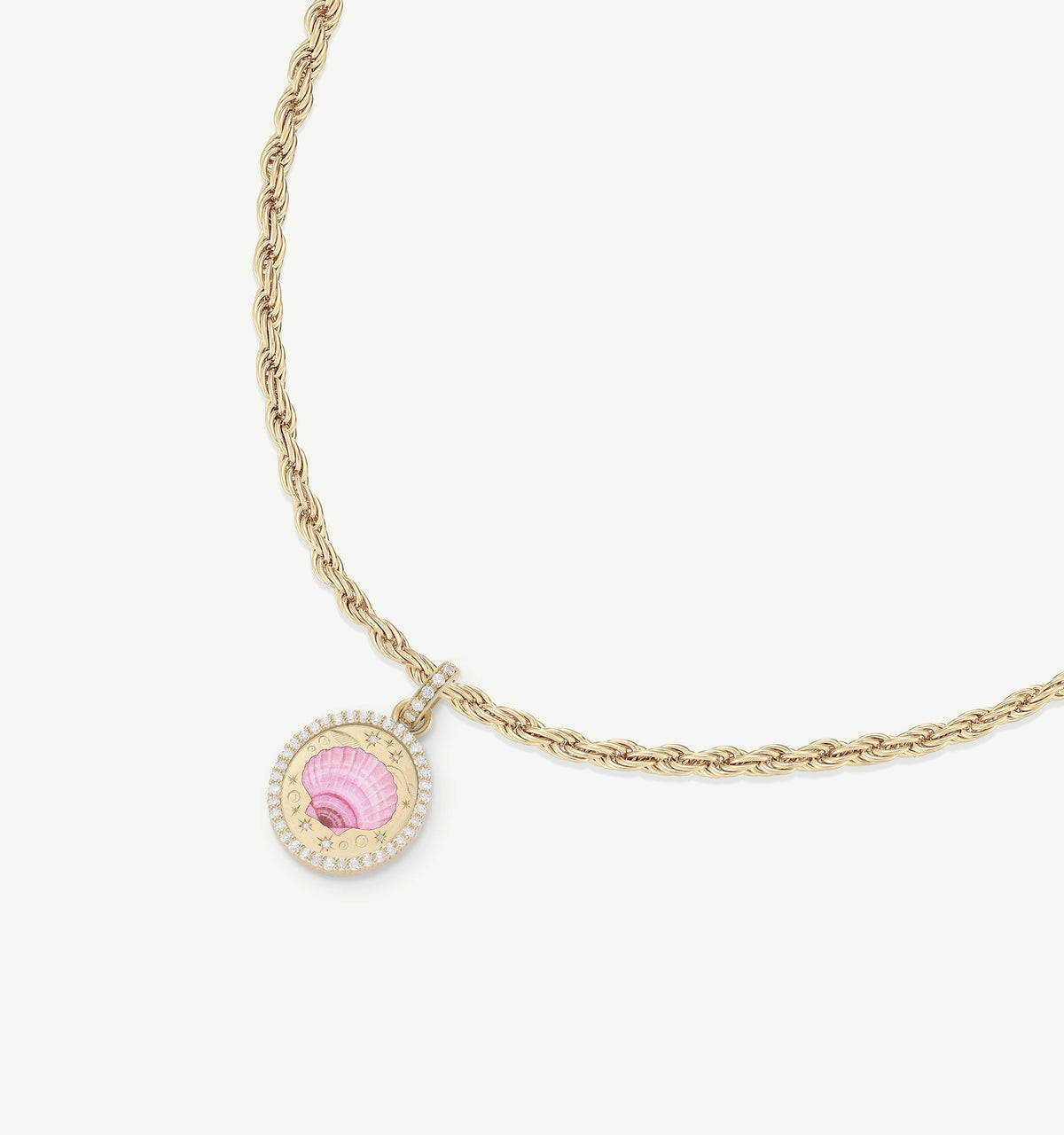 Gold necklace featuring a pink shell pendant with a diamond-encrusted border.