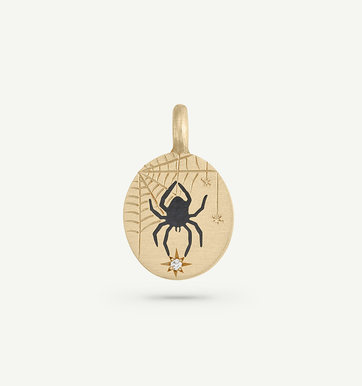 Gold pendant featuring a spider design with an engraved web and a diamond accent.