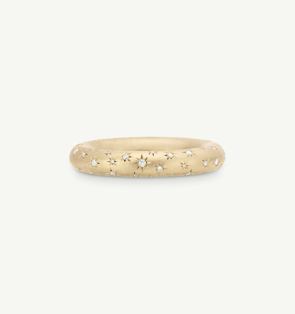 Gold ring featuring star engravings and small diamonds throughout the band.