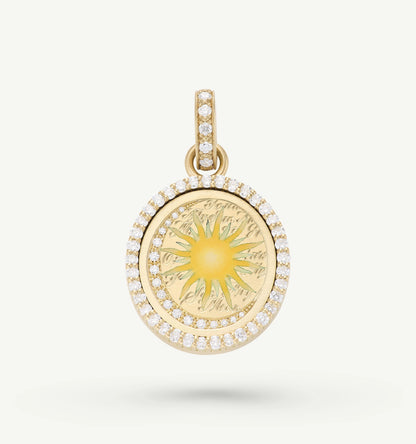 Gold pendant featuring an engraved sun motif surrounded by a halo of round diamonds.