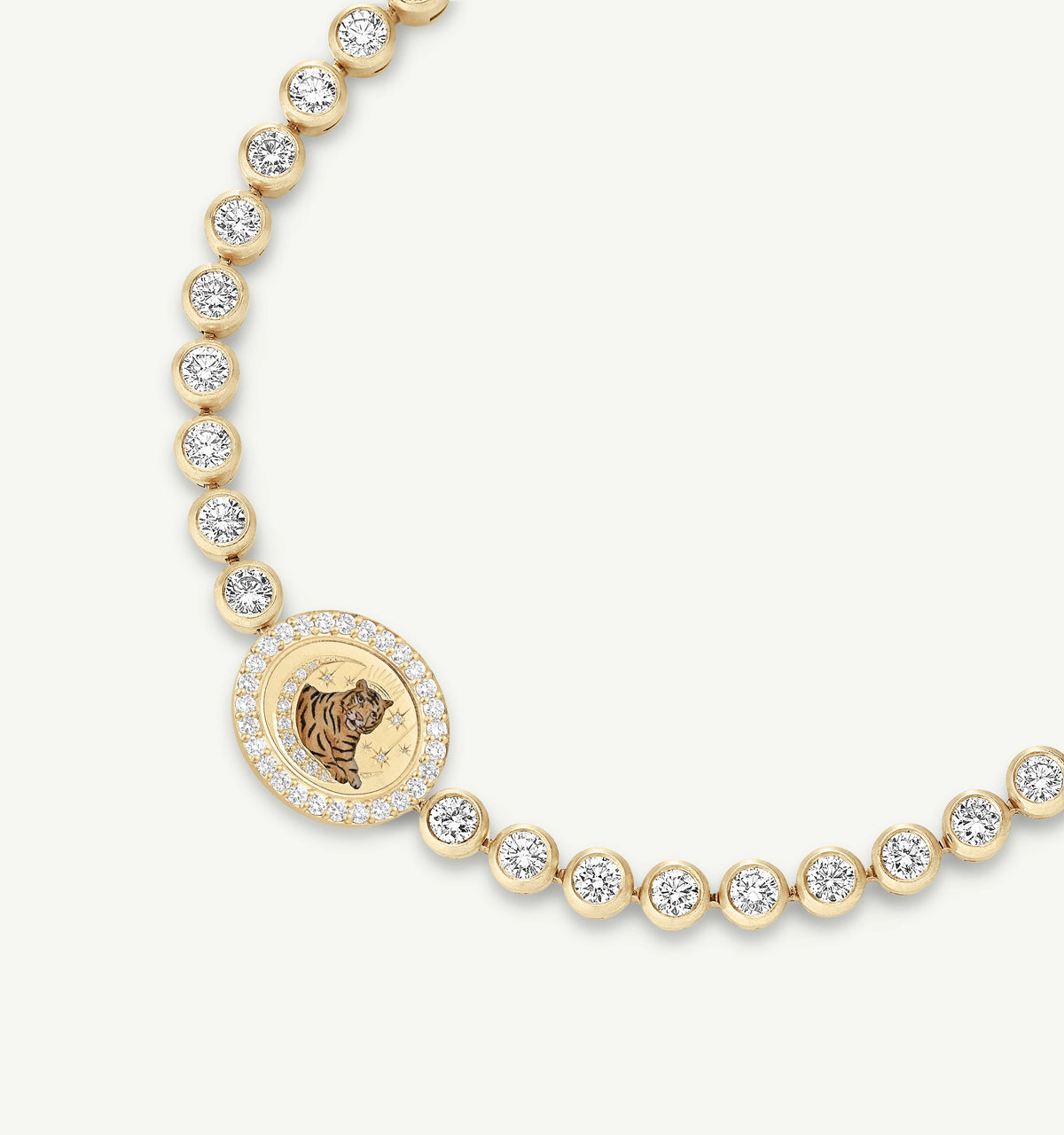 Gold necklace featuring a circular pendant with a tiger and surrounded by diamonds.