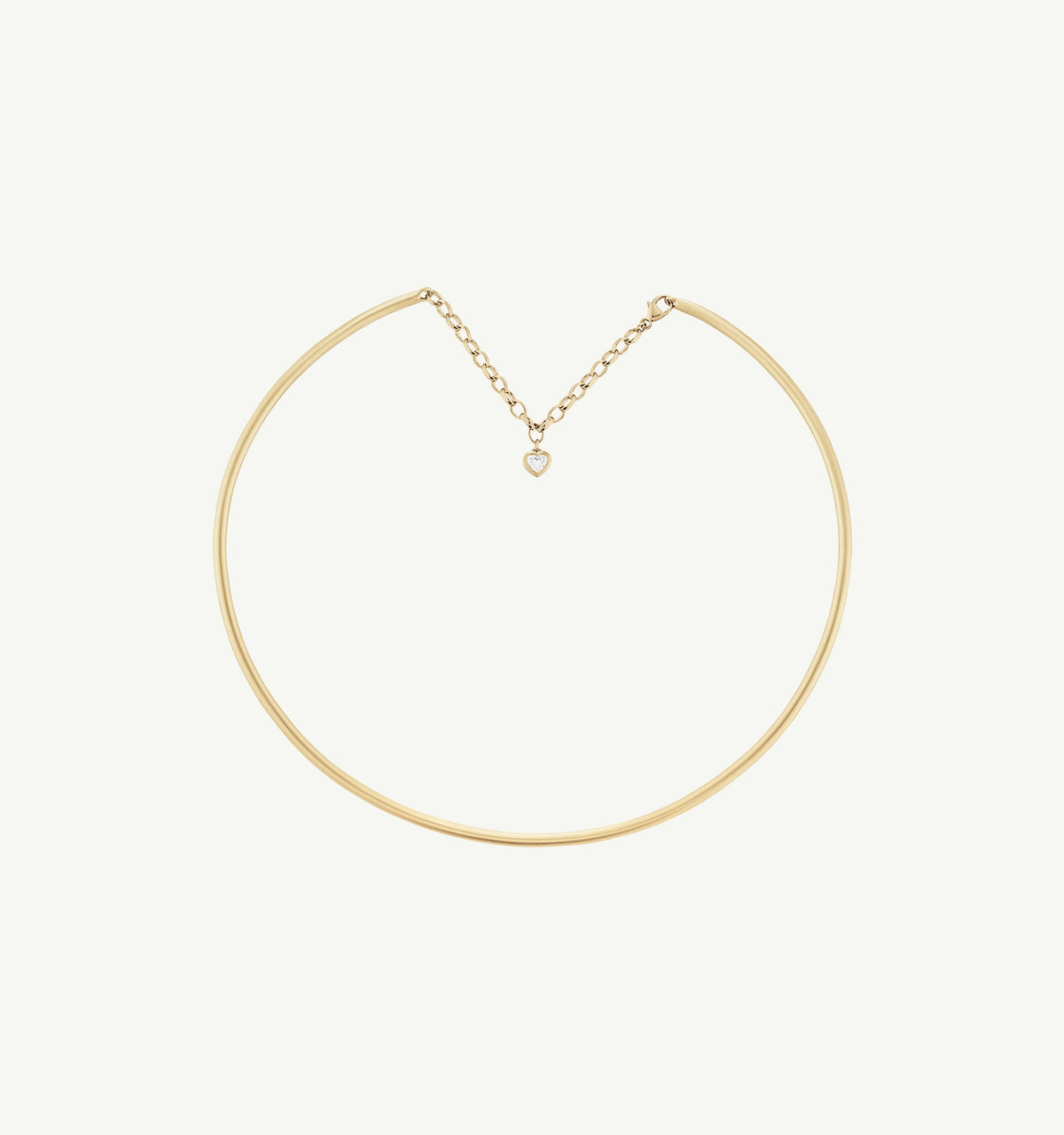 Gold choker necklace featuring a heart-shaped pendant with a diamond accent.