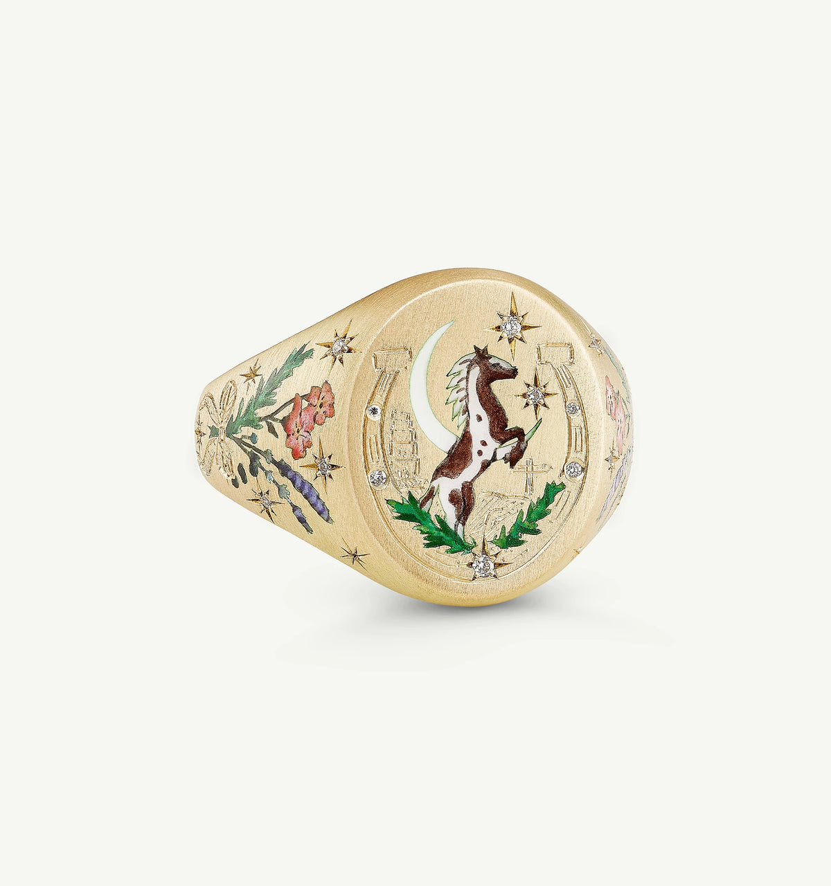 Gold ring featuring a horse, flowers, and stars with colourful enamel detailing and small diamonds.