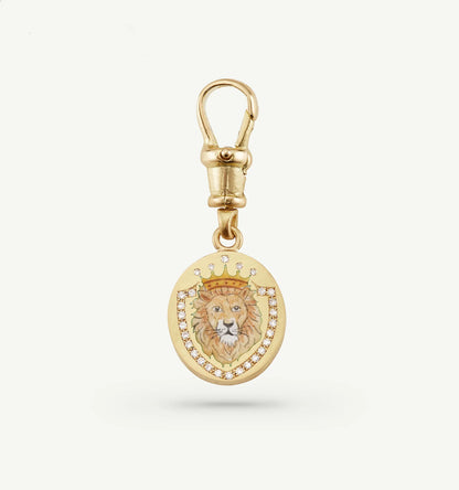 Gold pendant featuring a lion illustration and a crown, embellished with diamonds.