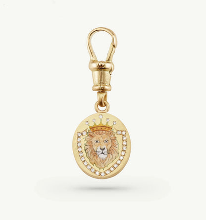 Gold pendant featuring a detailed lion motif with a crown, surrounded by diamonds.