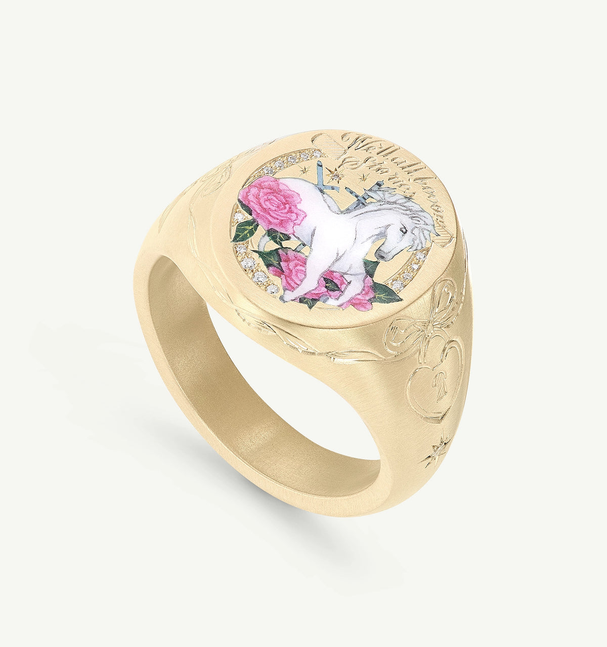 Gold ring featuring an engraved unicorn design with pink roses and decorative accents.