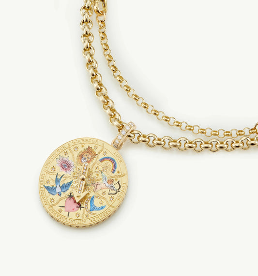 Gold necklace with a decorative pendant on a white background