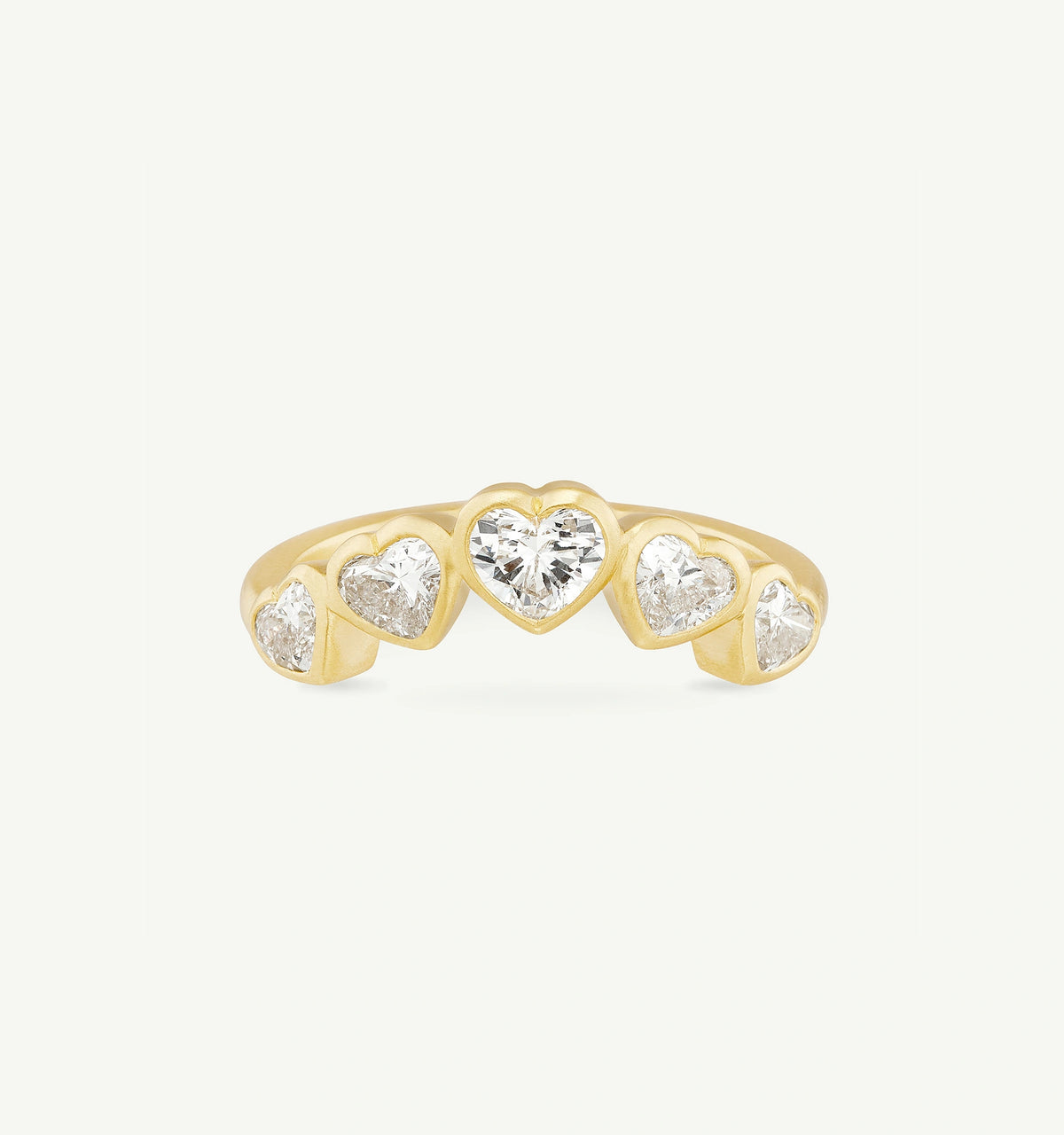 Gold ring featuring multiple heart-shaped diamonds.