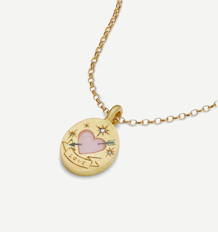 Gold pendant featuring a pink heart motif, engraved with "LOVE," and accented with stars and a decorative banner.
