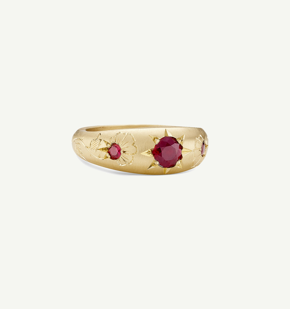Gold ring featuring engraved floral motifs and two rubies.