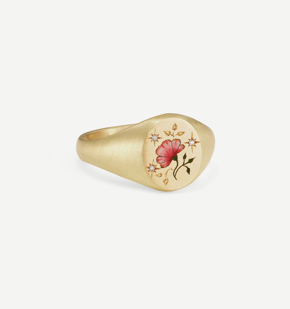 Gold ring featuring an engraved flower design with red and green details and four small diamonds.