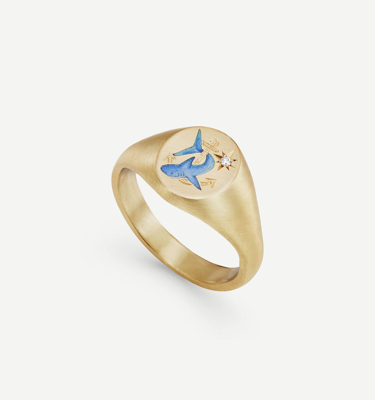 Gold signet ring featuring an engraved blue shark and a small diamond accent.